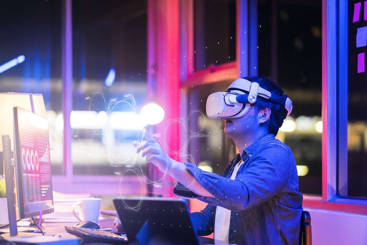 asian-young-male-wearing-wearable-goggle-headset-virtual-online-meeting-digital-space-working-with-3d-augmented-dimension-homecyber-virtual-working-with-virtual-v